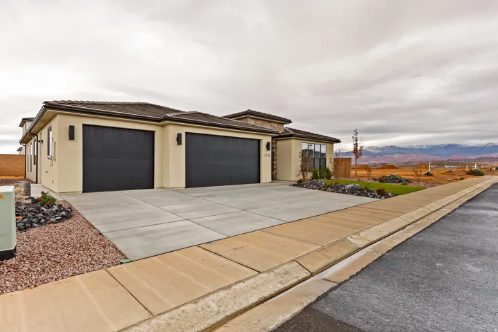 Contemporary stucco exterior with a stone accent facade