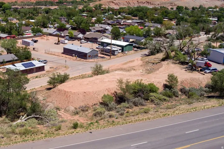 Expansive undeveloped land parcel with direct paved road frontage