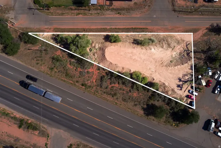 Expansive undeveloped land parcel with direct paved road frontage