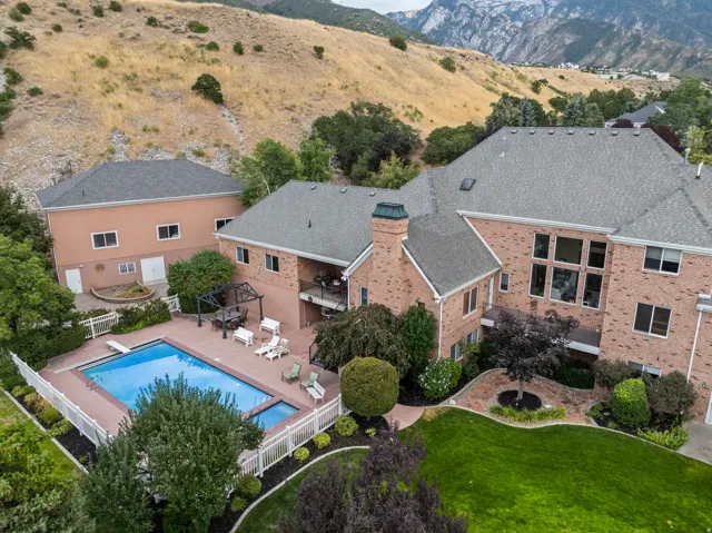 Aerial view of a mountainous background and a pool area