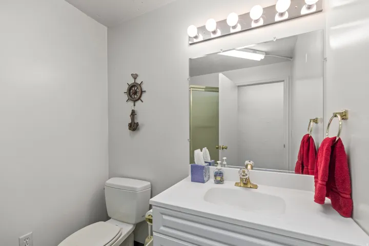 Full bath featuring vanity and a stall shower