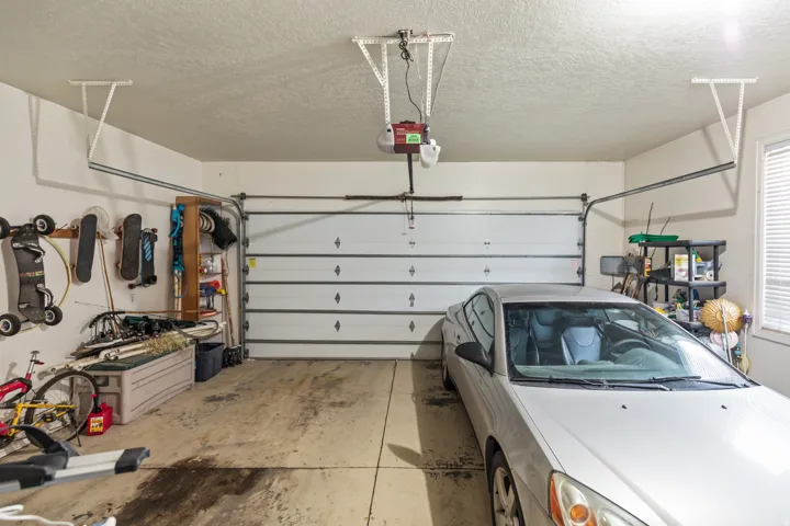 Garage featuring a garage door opener