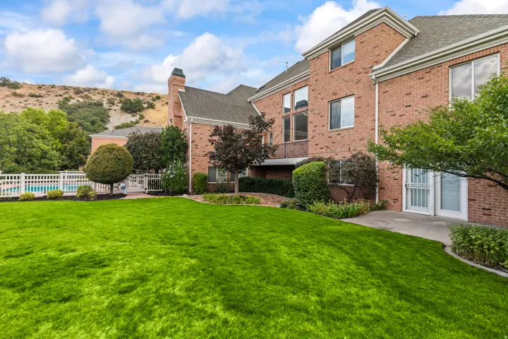View of yard with a balcony
