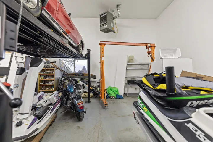 Garage featuring a heating unit