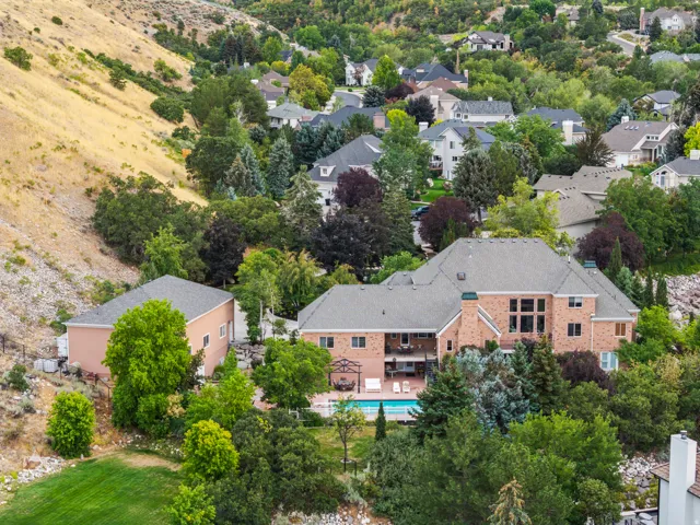 Aerial perspective of suburban area with a pool area