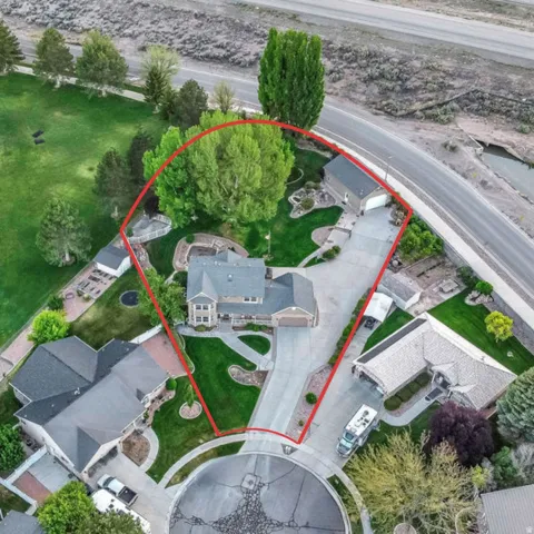Aerial perspective showcasing a spacious property with a cul-de-sac entrance