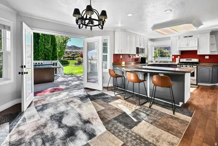 Open concept living area featuring French doors leading to an exterior deck