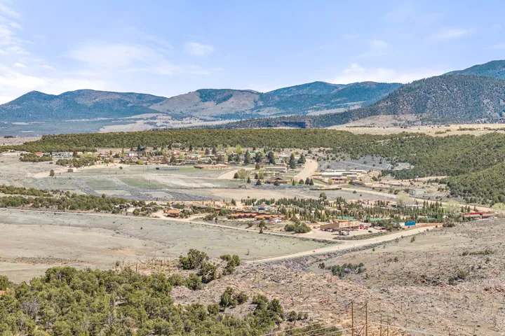 Expansive aerial perspective showcasing a community nestled within a valley