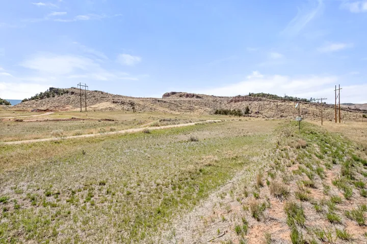 Expansive land parcel with rolling topography and natural vegetation