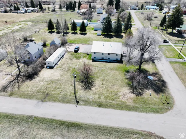 Aerial perspective showcasing multiple structures on a spacious parcel