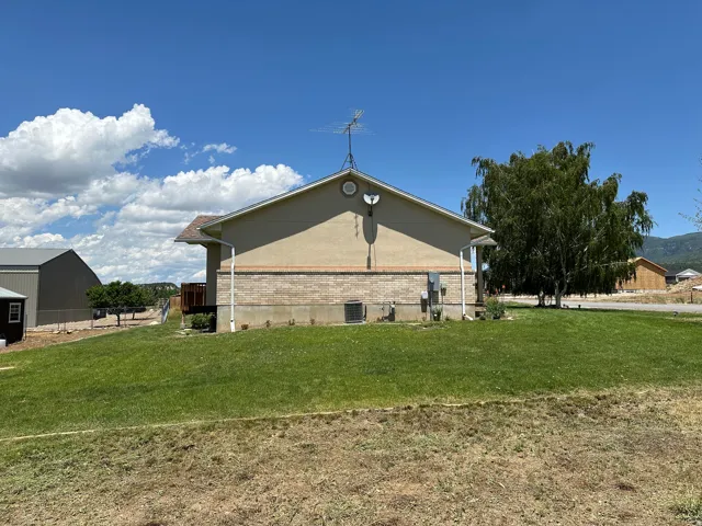 Rear exterior with stucco and brick siding