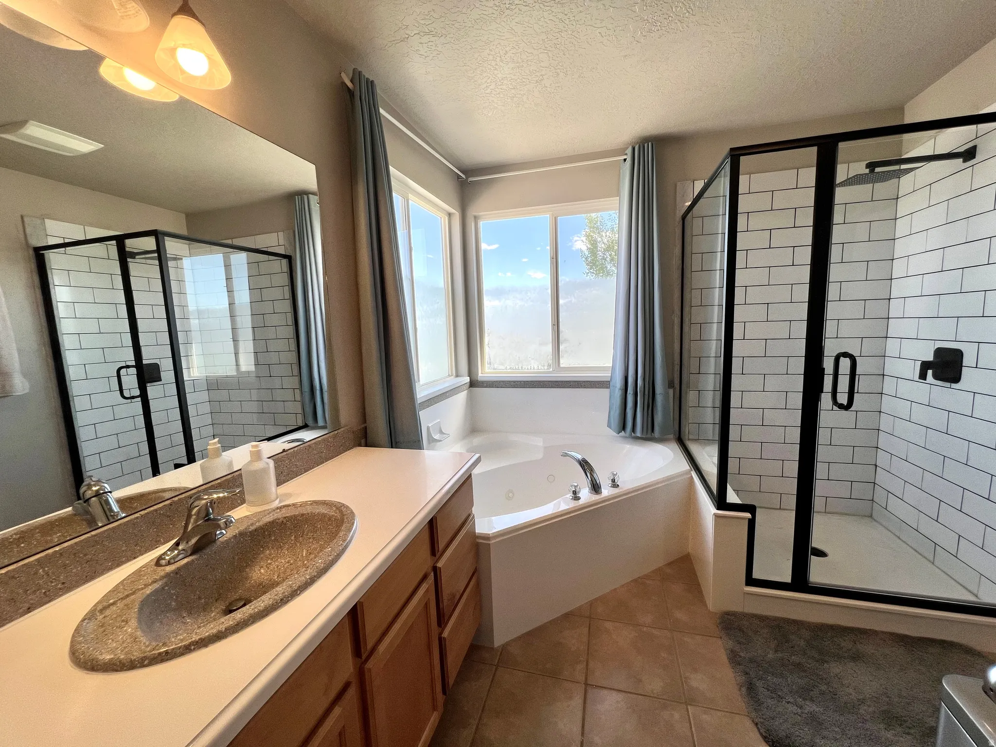 Primary Ensuite Bathroom with Soaking Tub and Separate Shower
