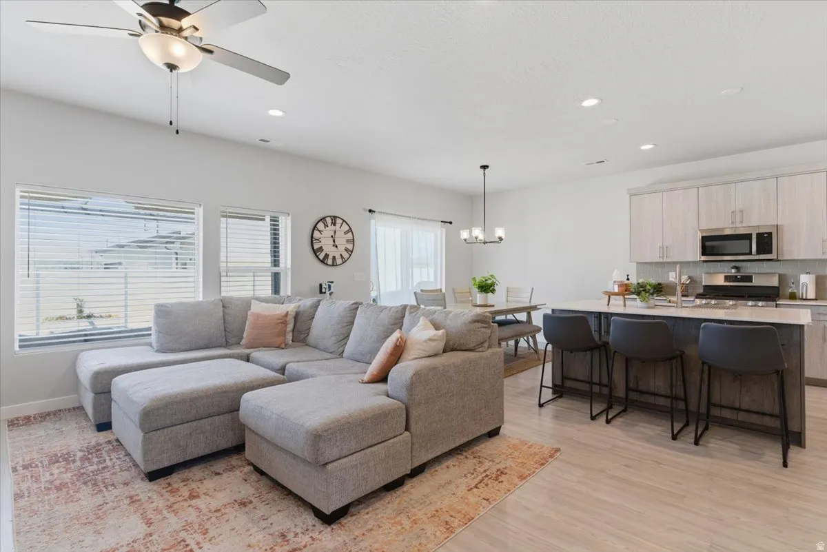 Open-concept living space with light-finish flooring throughout