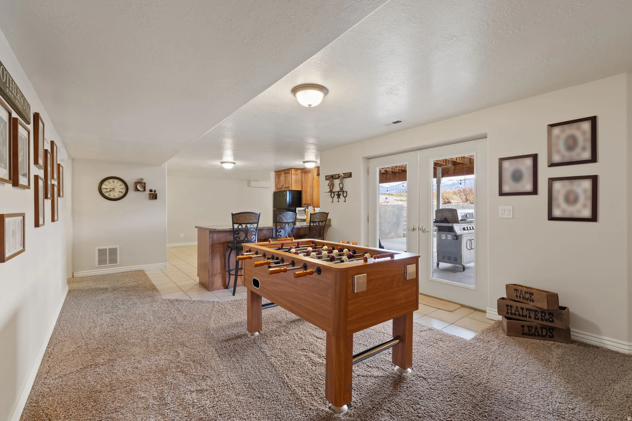 Spacious recreational area or flex space between basement kitchen and family room