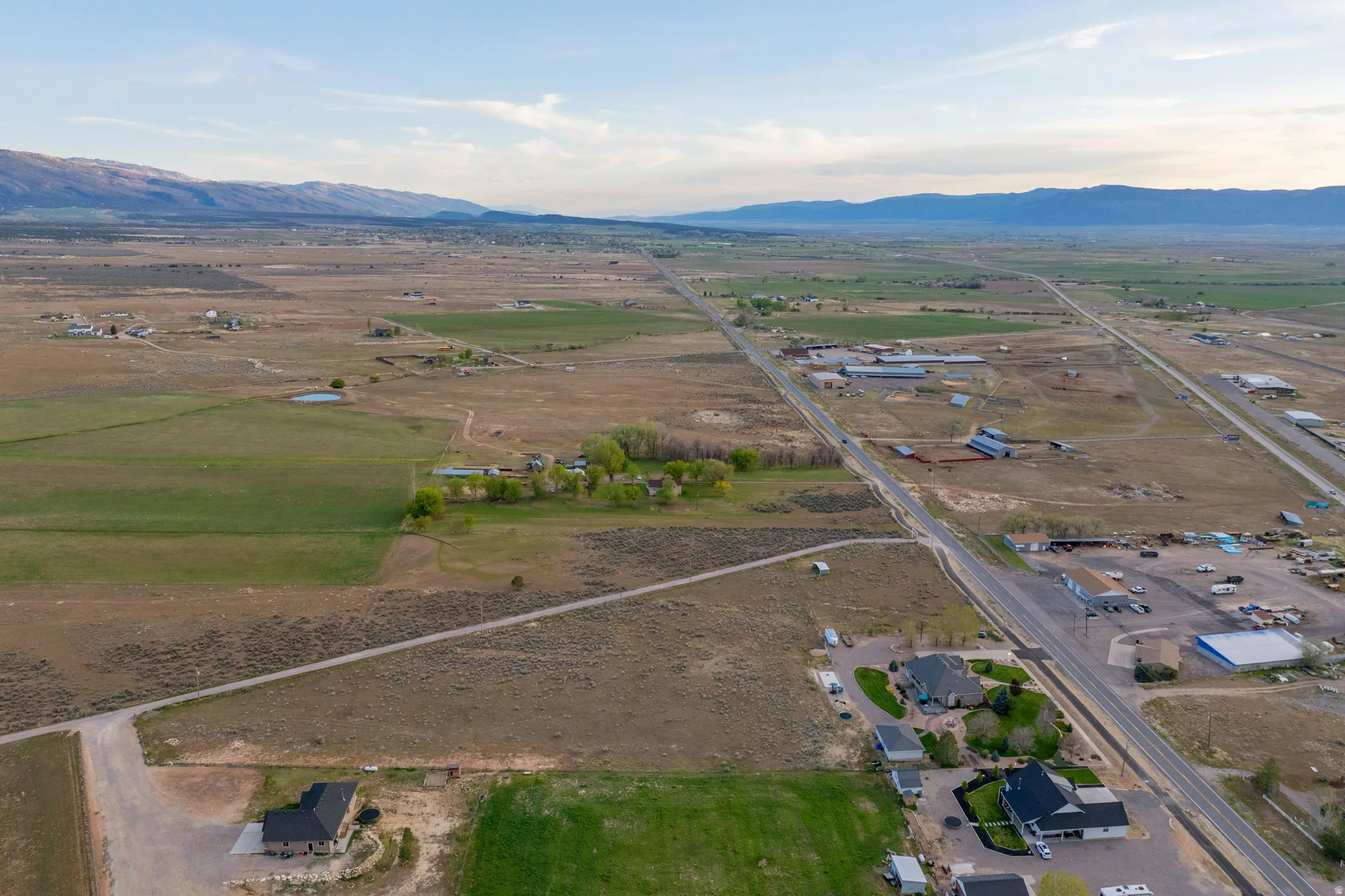 Expansive property featuring vast open land and distinct green fields