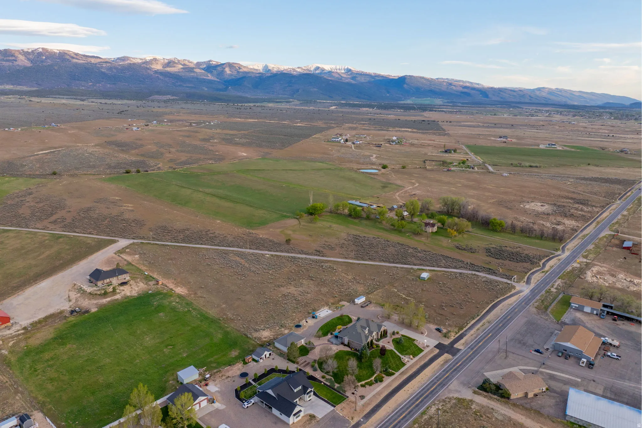 Expansive property featuring vast open land and distinct green fields