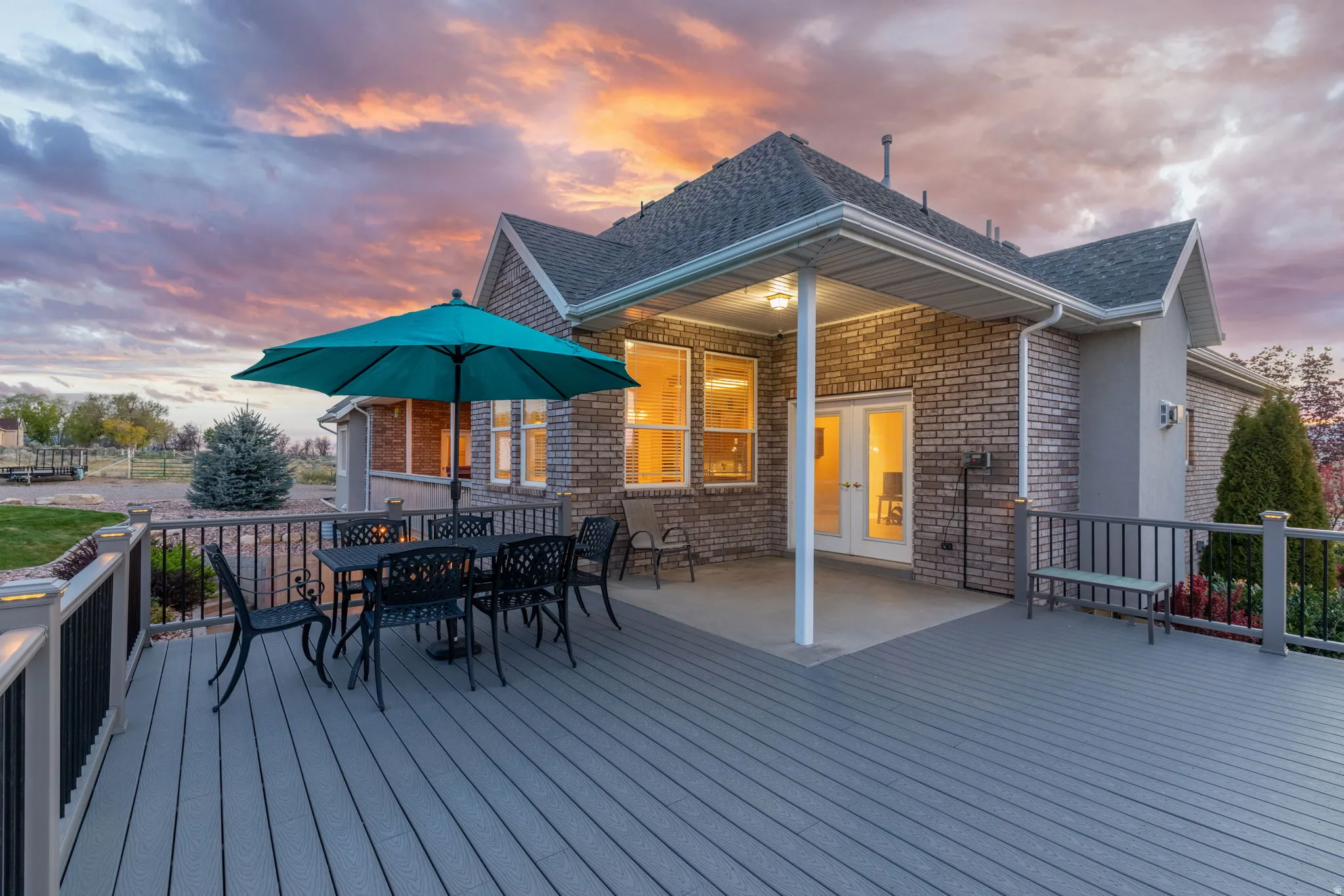Spacious composite deck with dark railings and integrated lighting