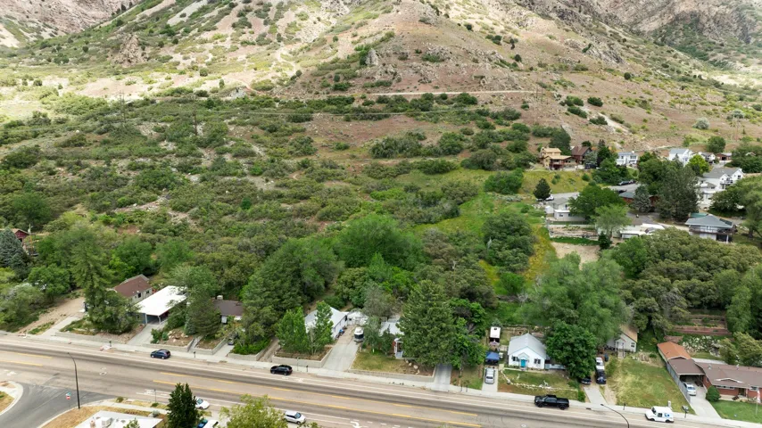 Expansive land parcel featuring dense natural vegetation and a mountainous backdrop