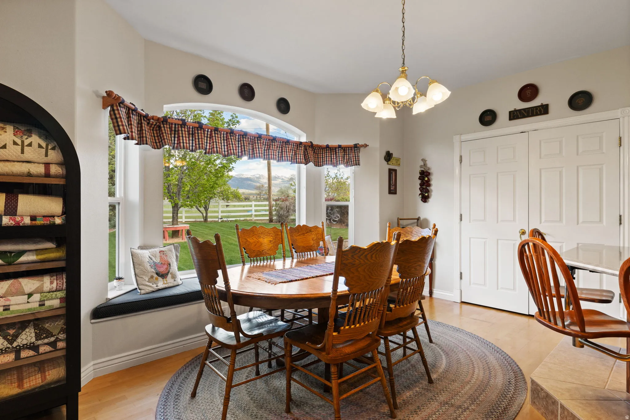 Dining area featuring a prominent bay window with an integrated window seat