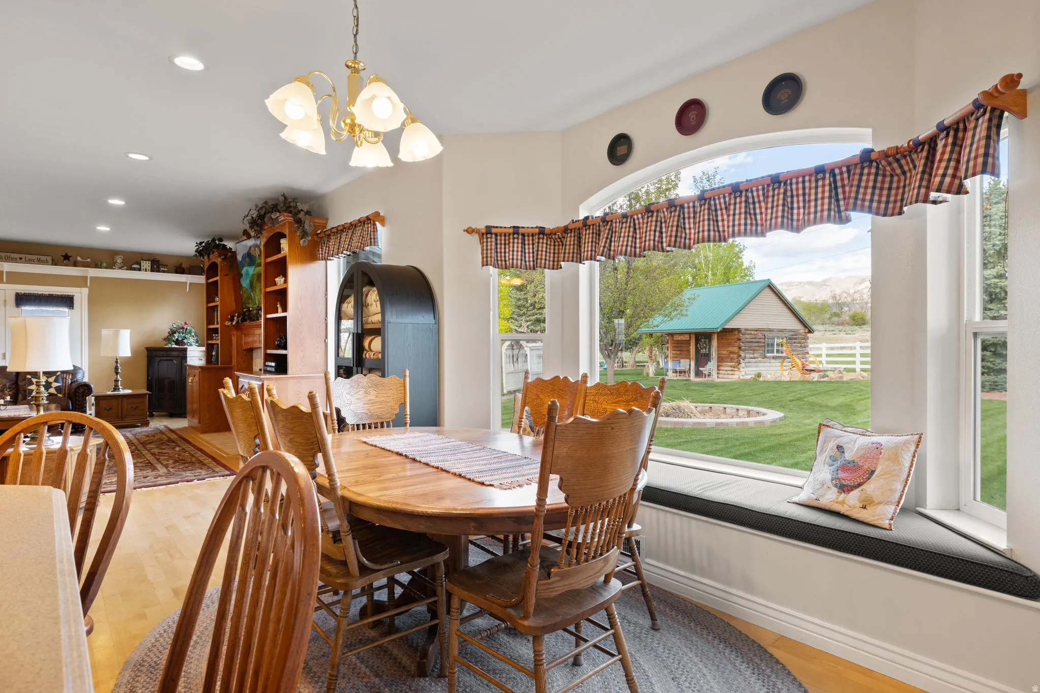 Dining area featuring wood-finish flooring and a large bay window with an integrated window seat