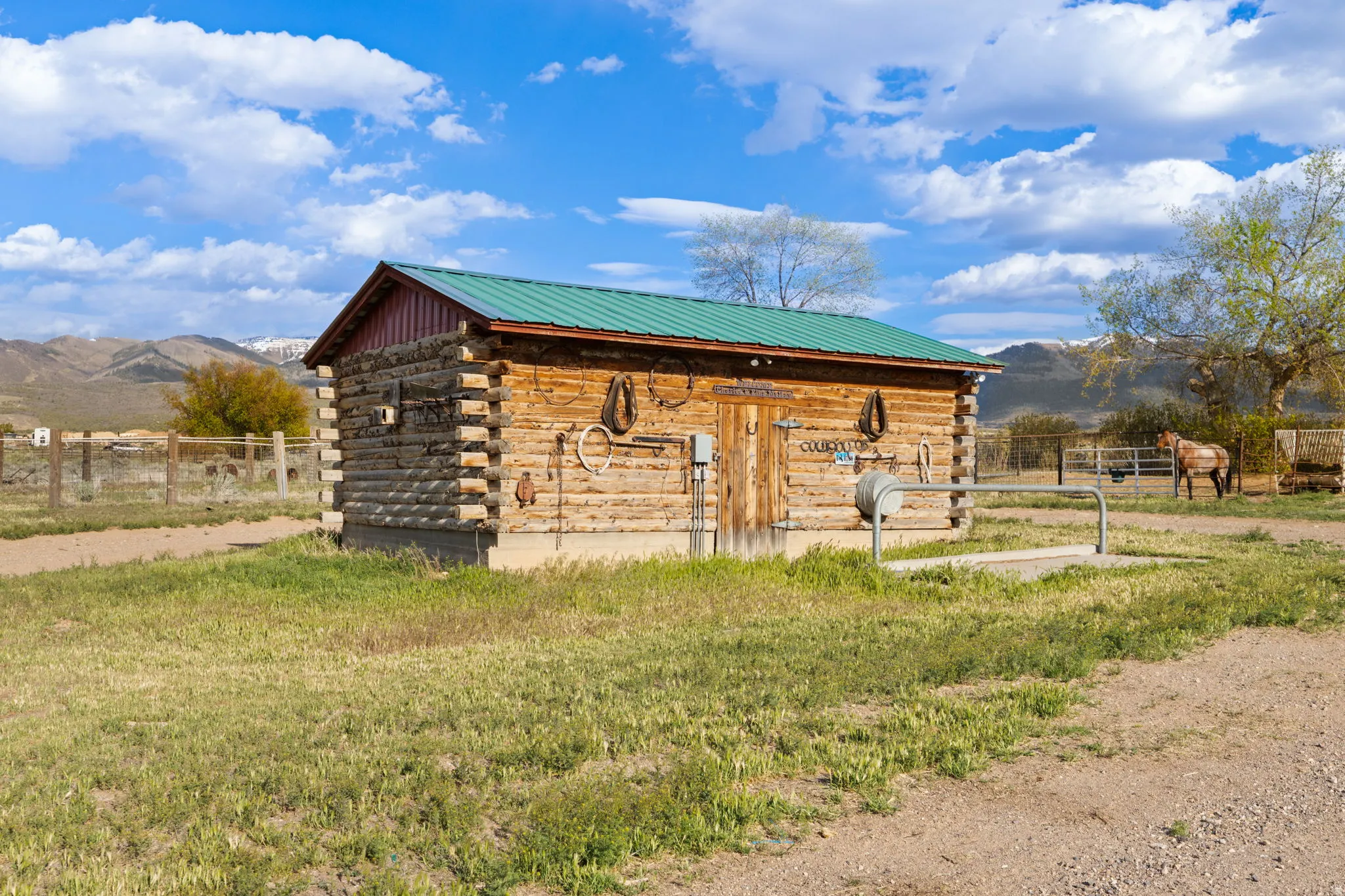 Log cabin tack shed with power and hitching post