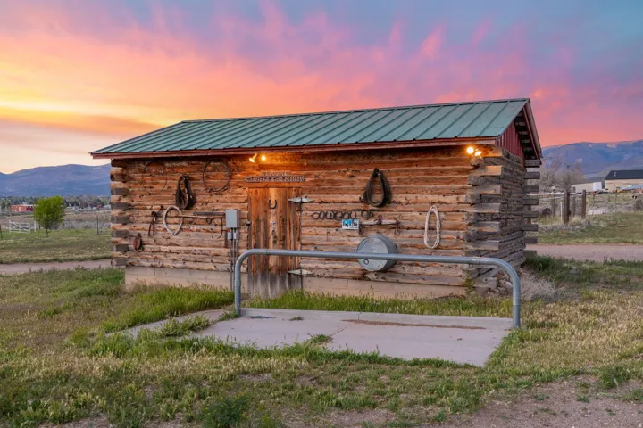 Log cabin tack shed with power and hitching post