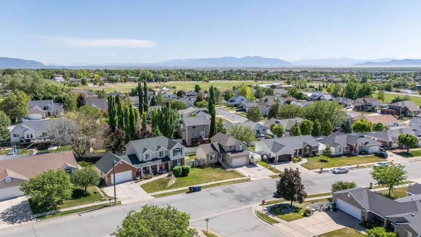 Residential neighborhood featuring a variety of architectural styles, mature landscaping, and tree-lined streets