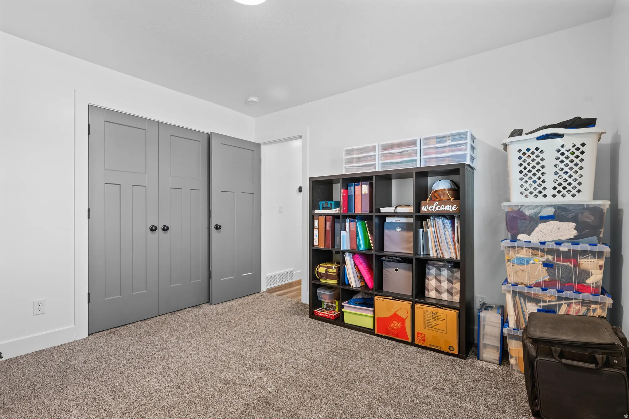 Textured carpet flooring with white baseboards