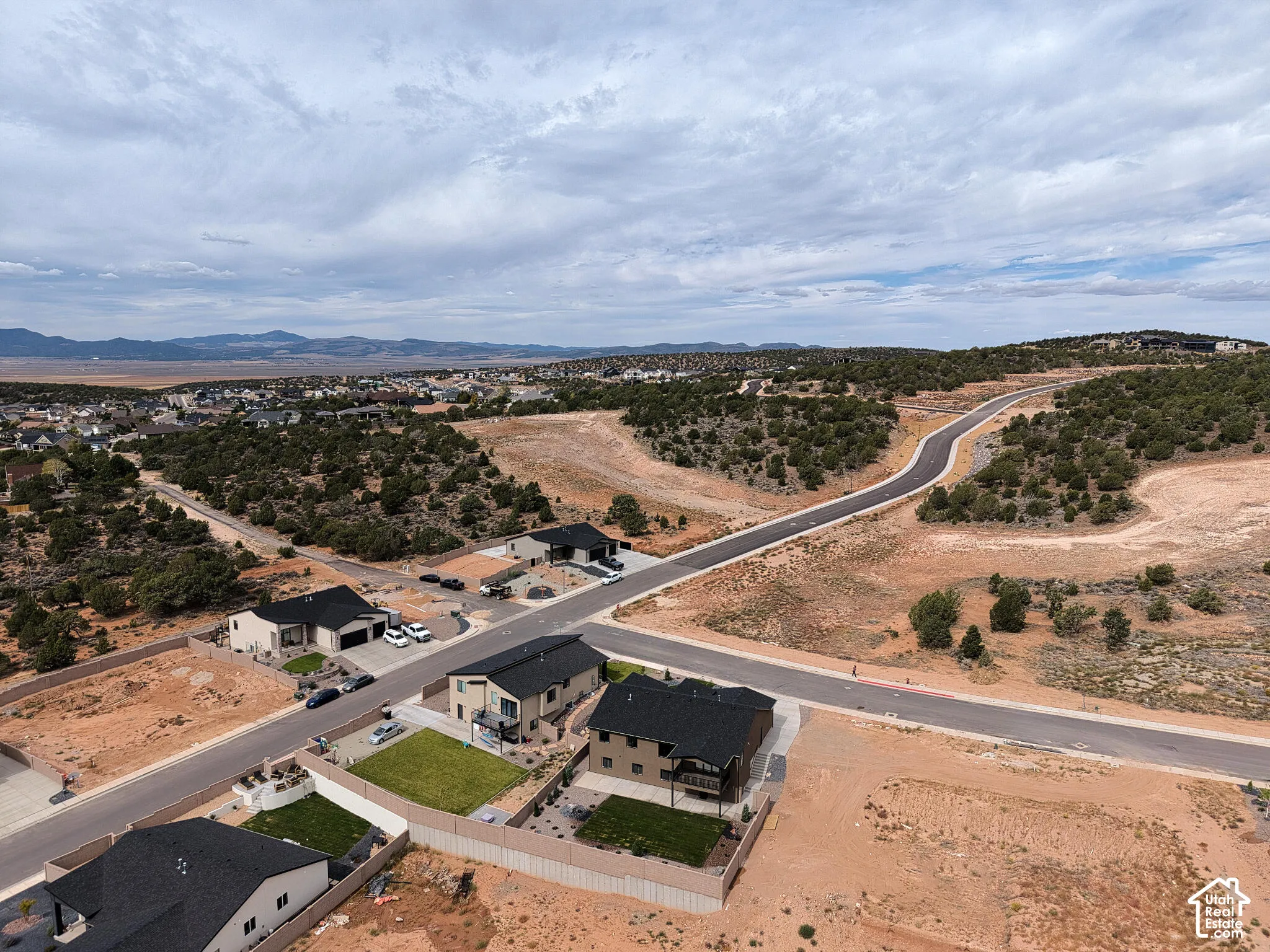 Residential development featuring paved streets, established homes, and undeveloped lots
