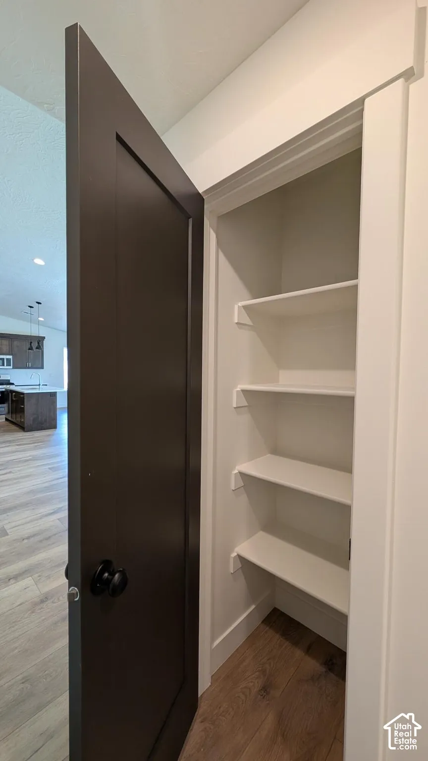 Built-in shelving with wood-finish flooring