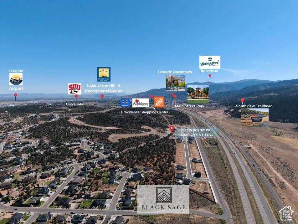 Aerial perspective showcasing proximity to major roadways, suburban residential developments, and distant natural landscapes