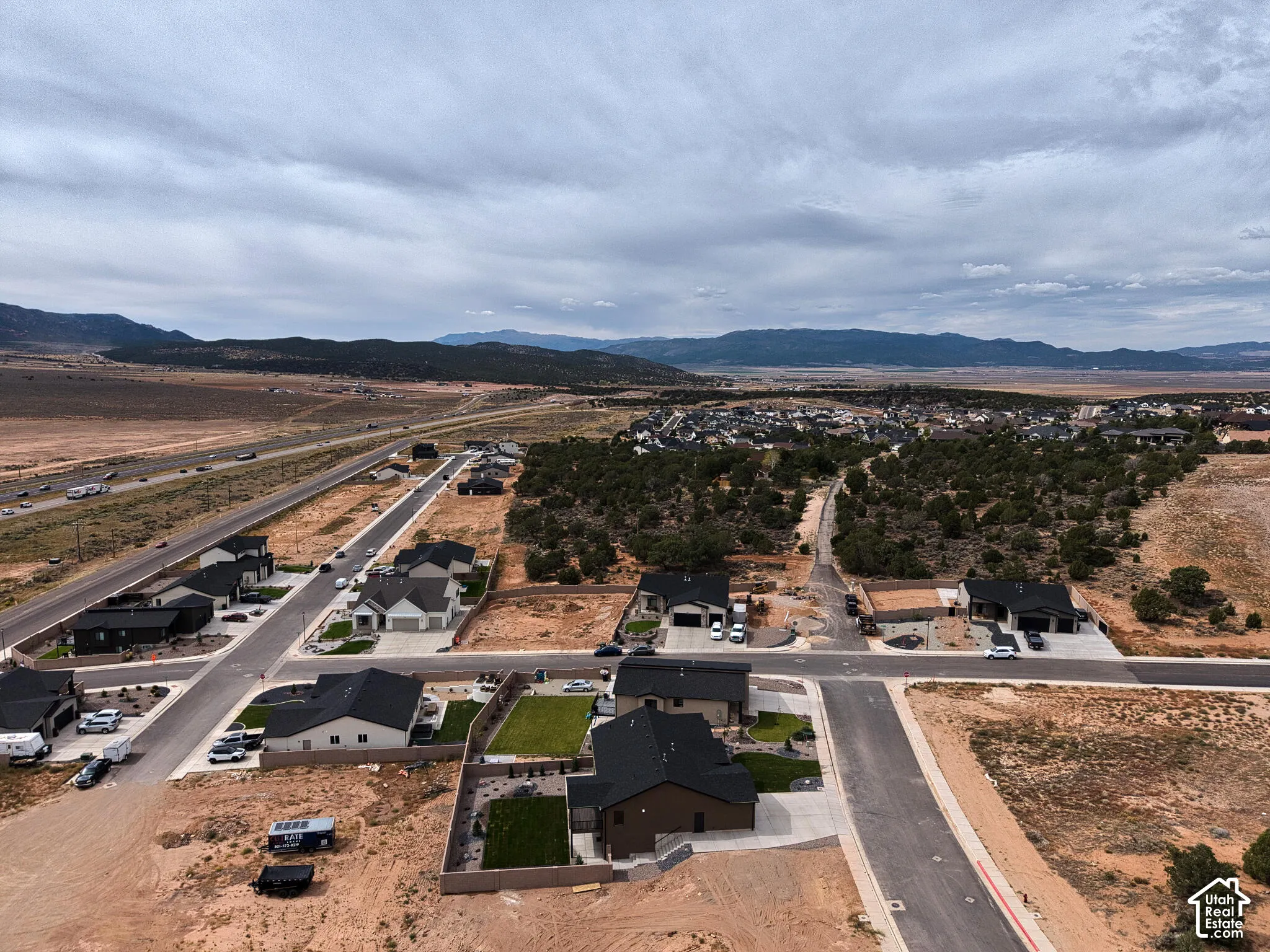 Newly developed residential area with paved streets and established homes