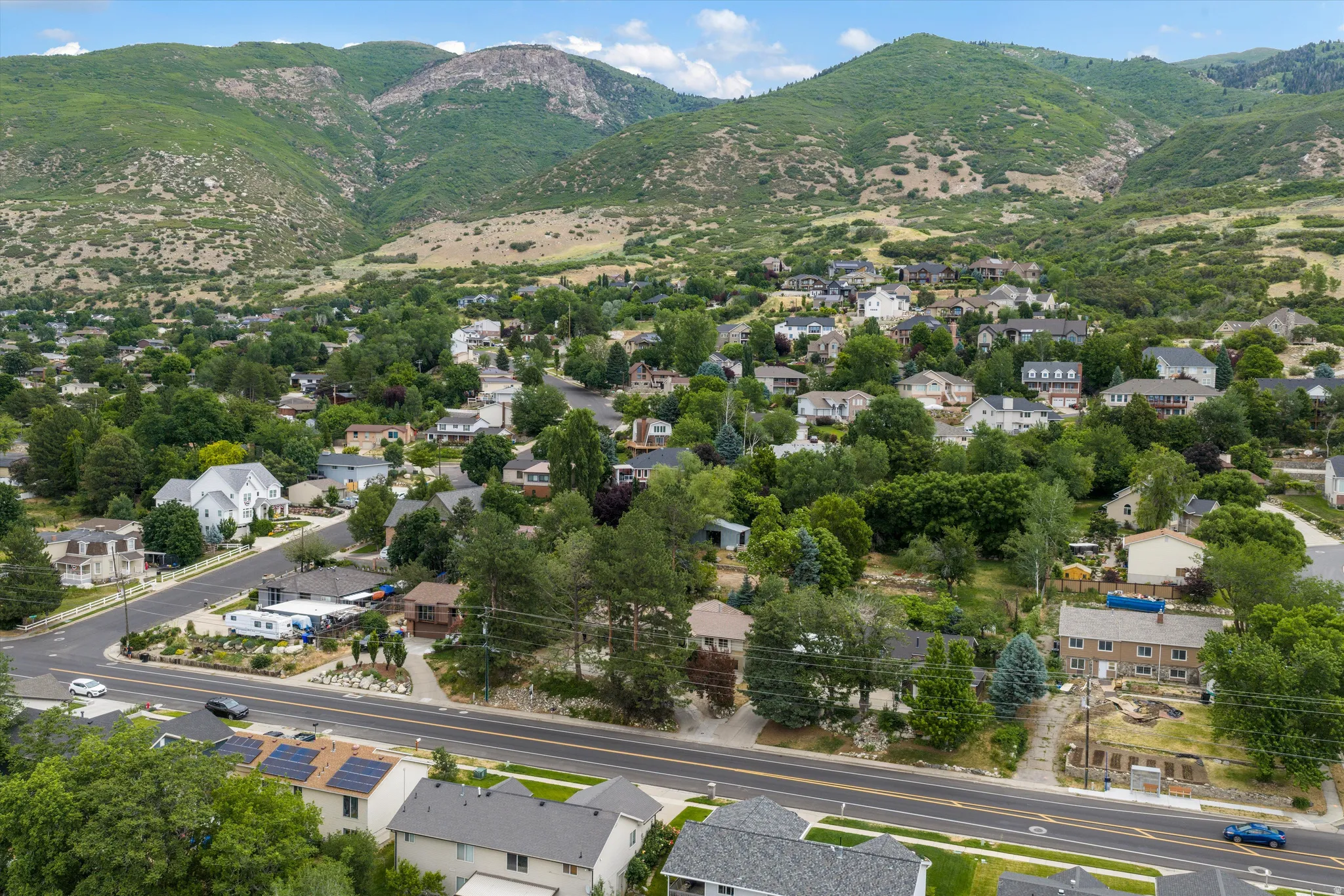 Residential community nestled against a mountainous backdrop