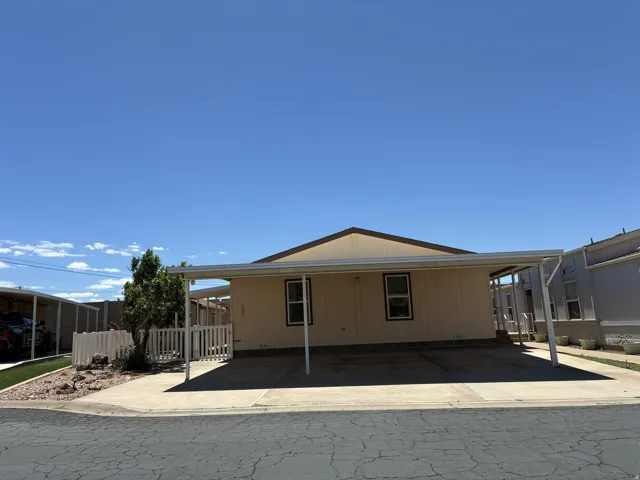 Exterior with a 3-car covered carport