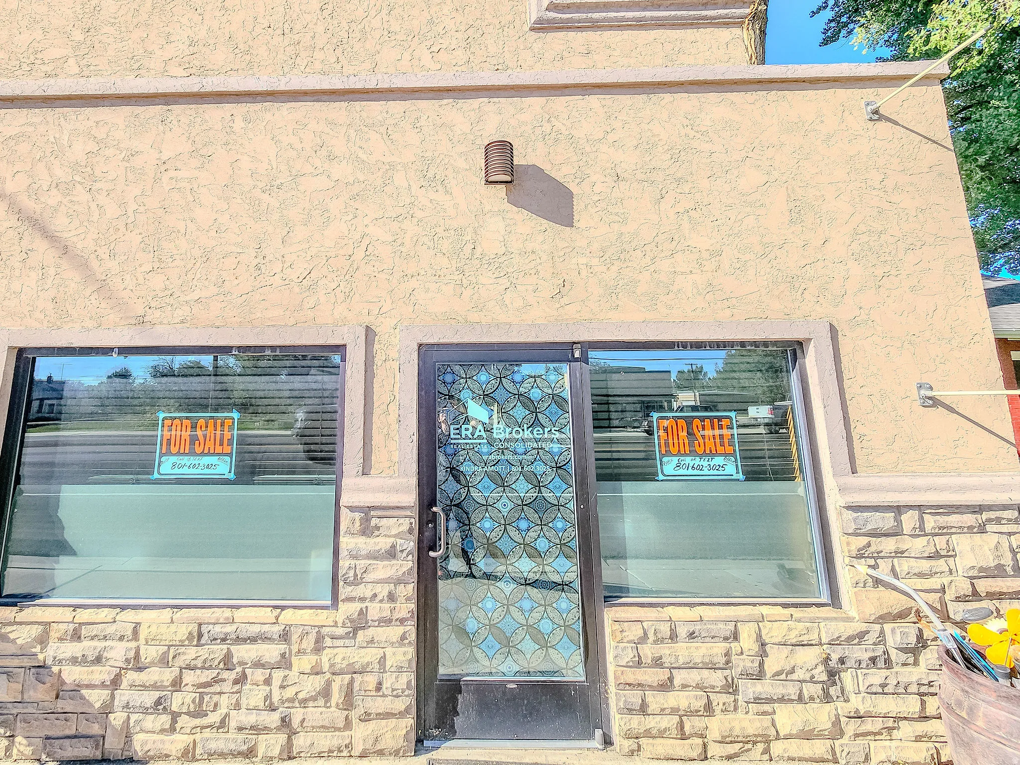 Stucco exterior with stone veneer accents
