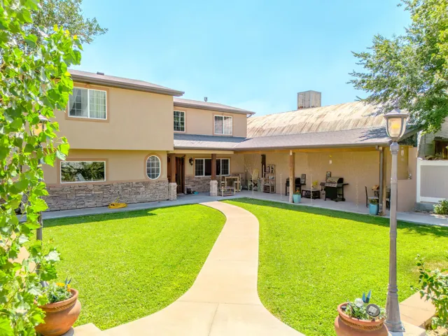 Two-story exterior with stucco finish and stone accents