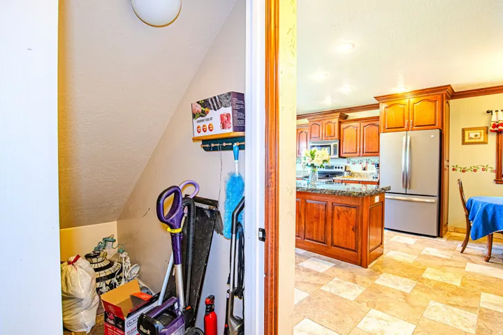 Under stair storage closet in hallway