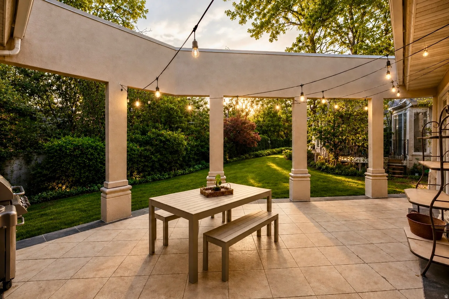 Covered patio featuring a tiled surface and string lights
