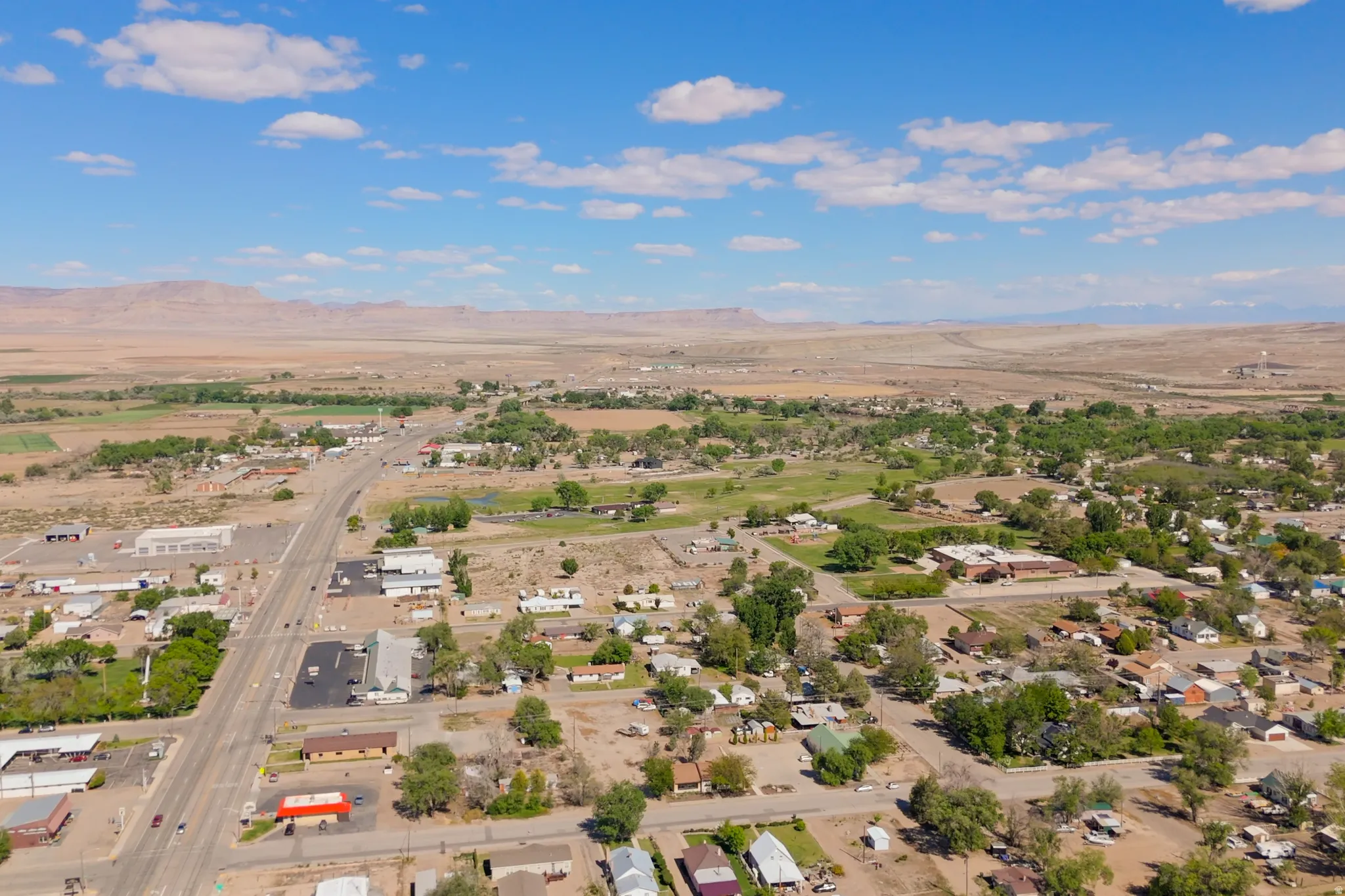 Aerial perspective showcasing a community with varied residential and commercial structures