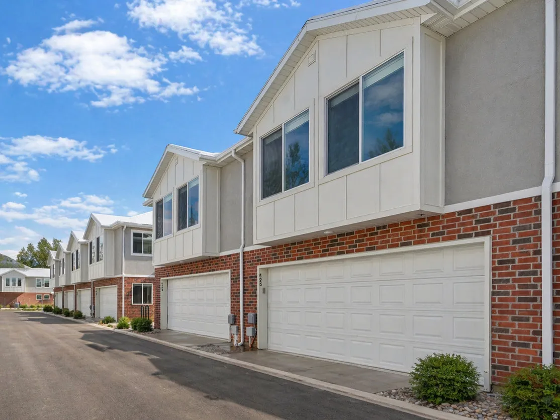 Modern townhome exterior with brick and siding facade