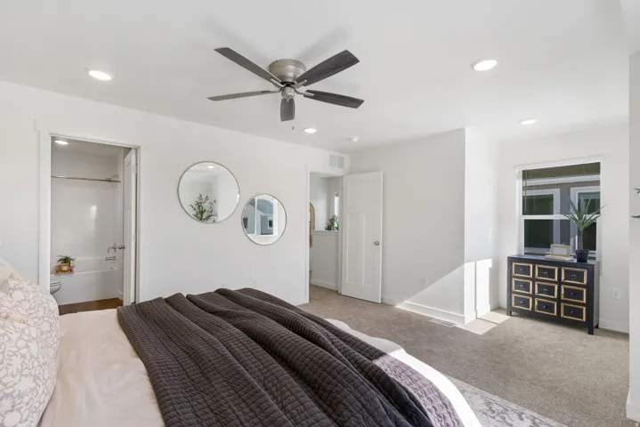 Carpeted bedroom featuring recessed lighting, a ceiling fan, and a window with blinds