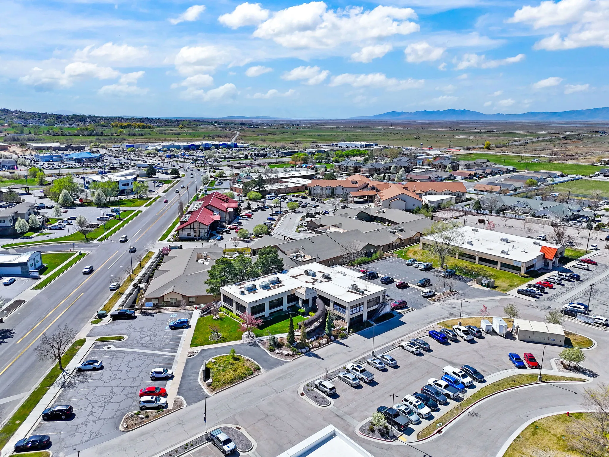 Commercial building with a flat roof and extensive surface parking