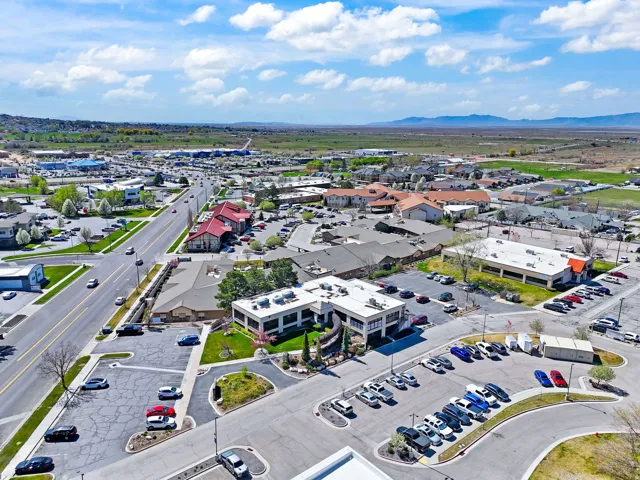 Commercial building with a flat roof and extensive surface parking