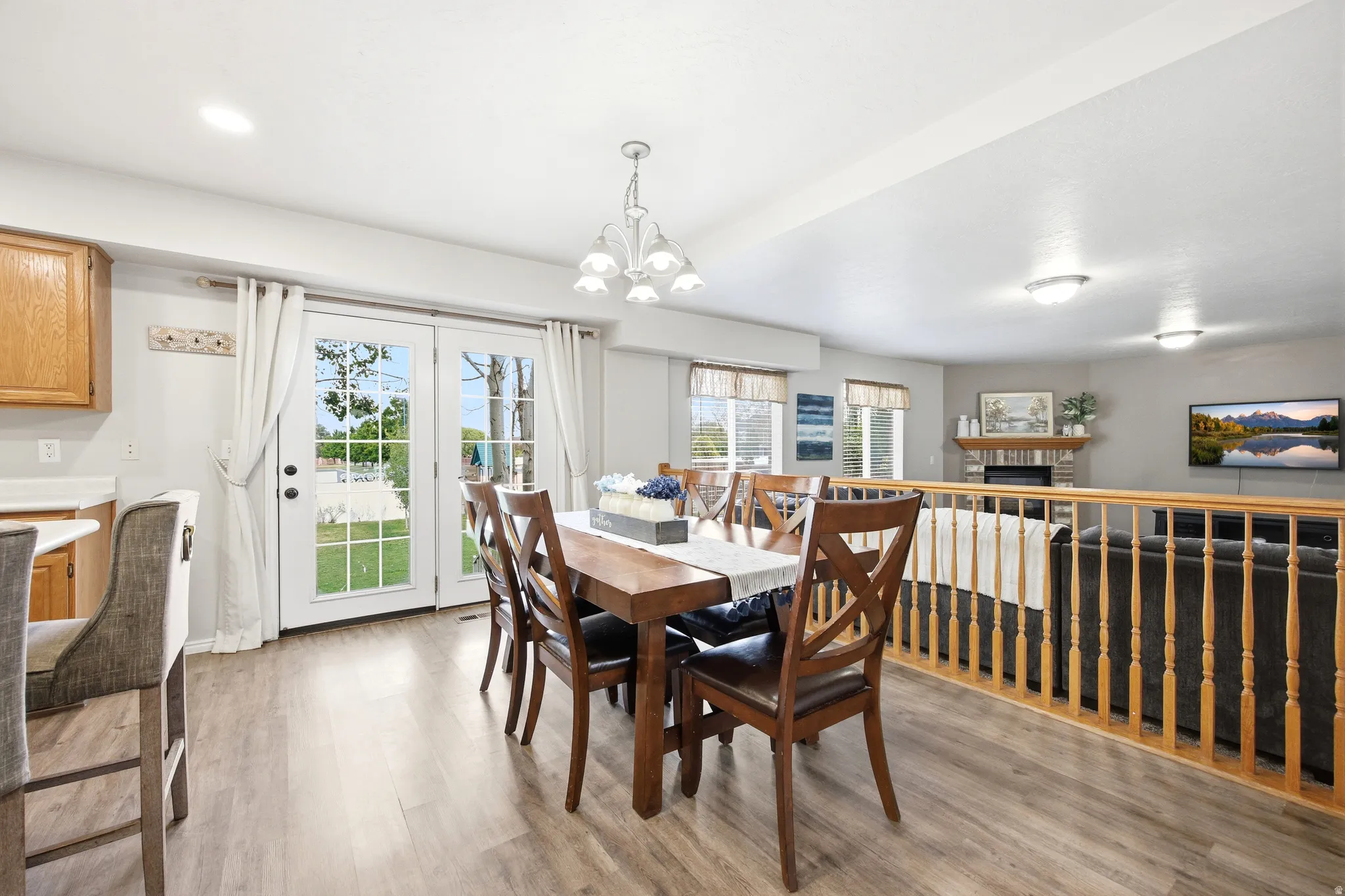 Open concept dining area featuring wood-finish flooring