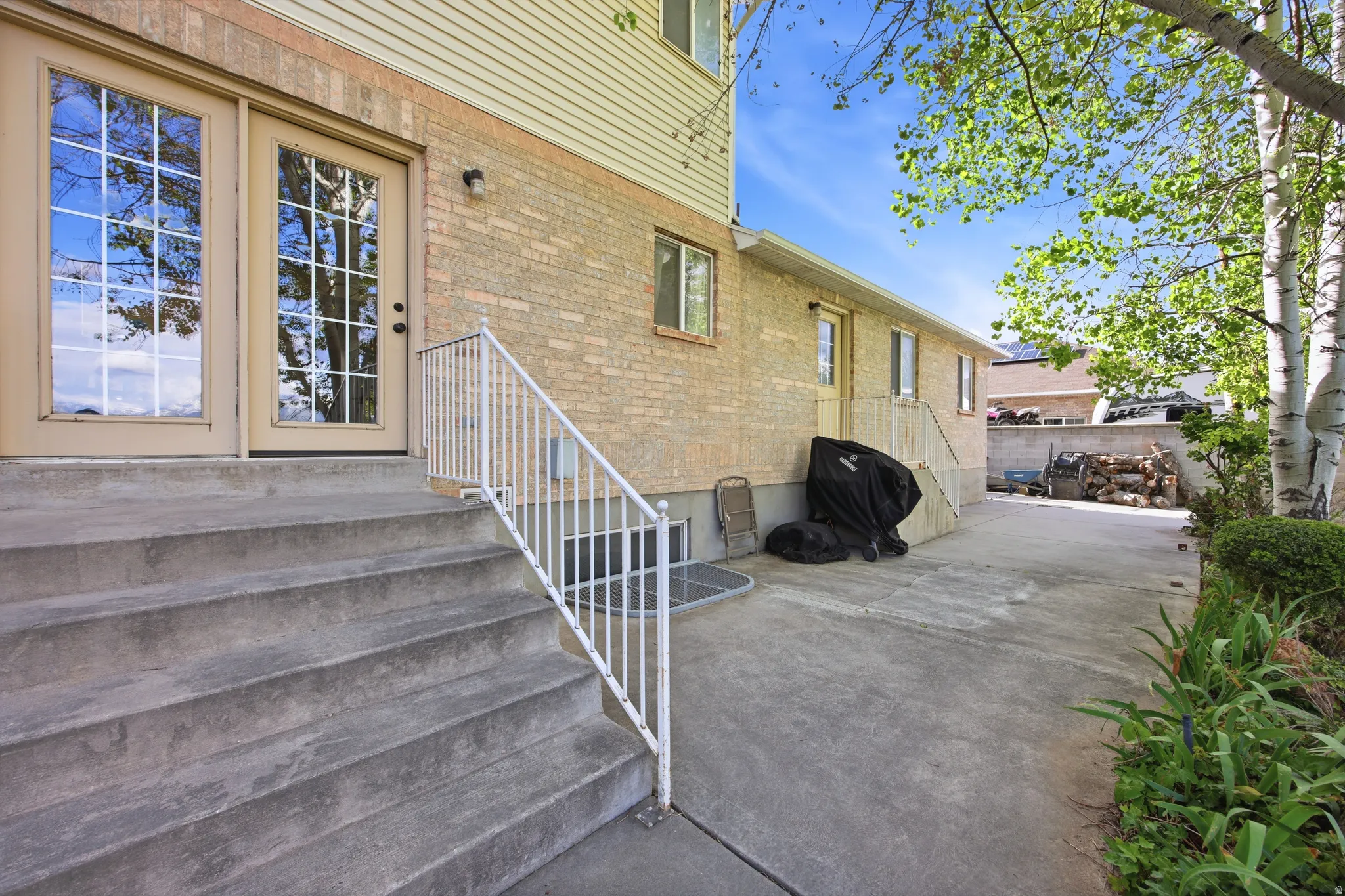 Concrete steps with white metal railing