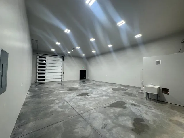 Spacious interior with high ceilings and polished concrete flooring