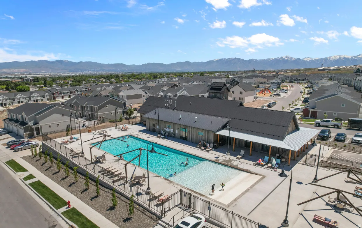 Community swimming pool with an integrated shallow wading area