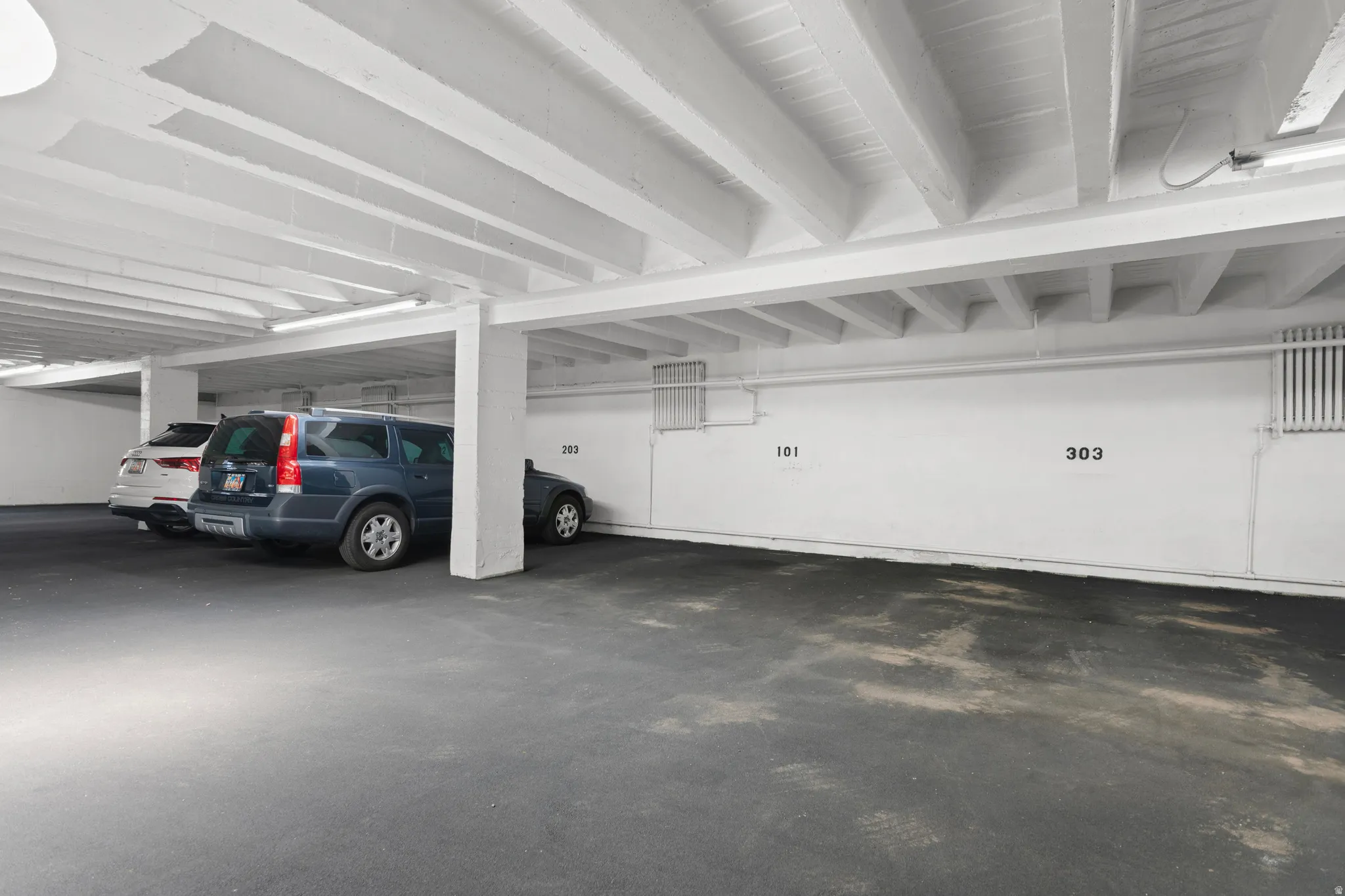 Dedicated indoor parking space within a structured garage