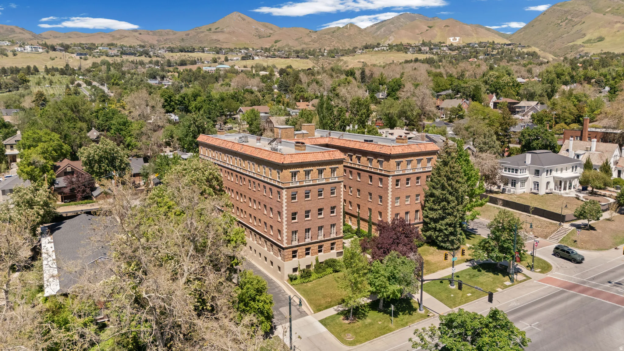 Historic brick apartment building featuring classical architectural details