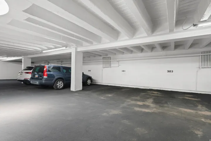Dedicated indoor parking space within a structured garage